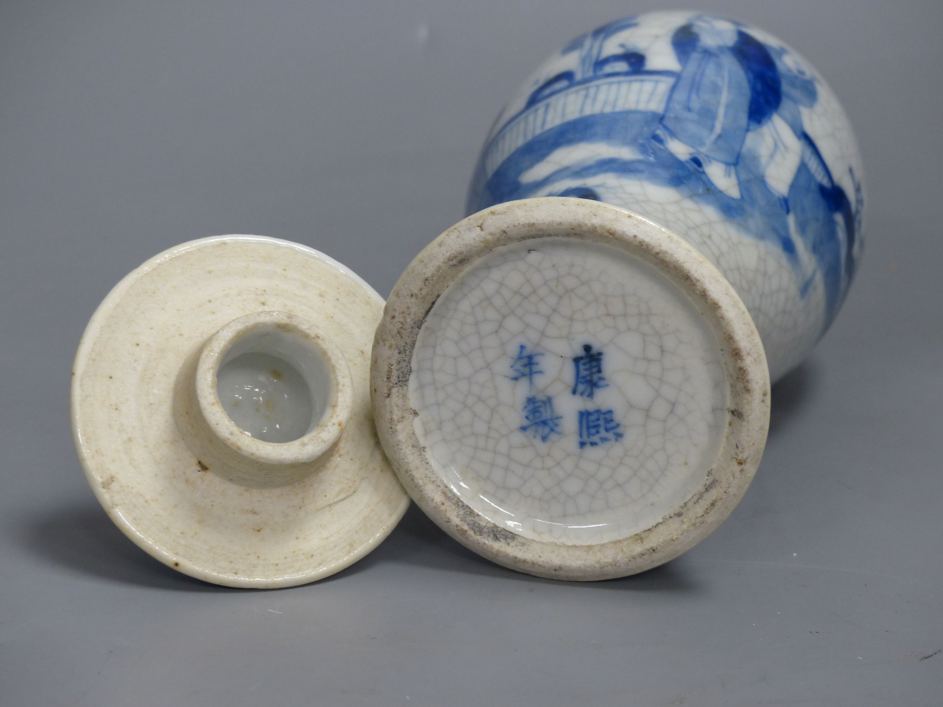 A late 19th century Chinese blue and white crackle glaze vase and cover, height 27cm